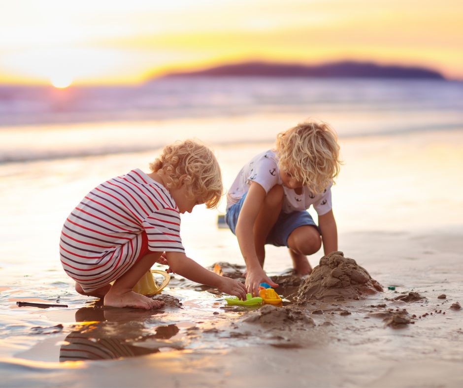 Children playing in the sand on a Los Cabos beach