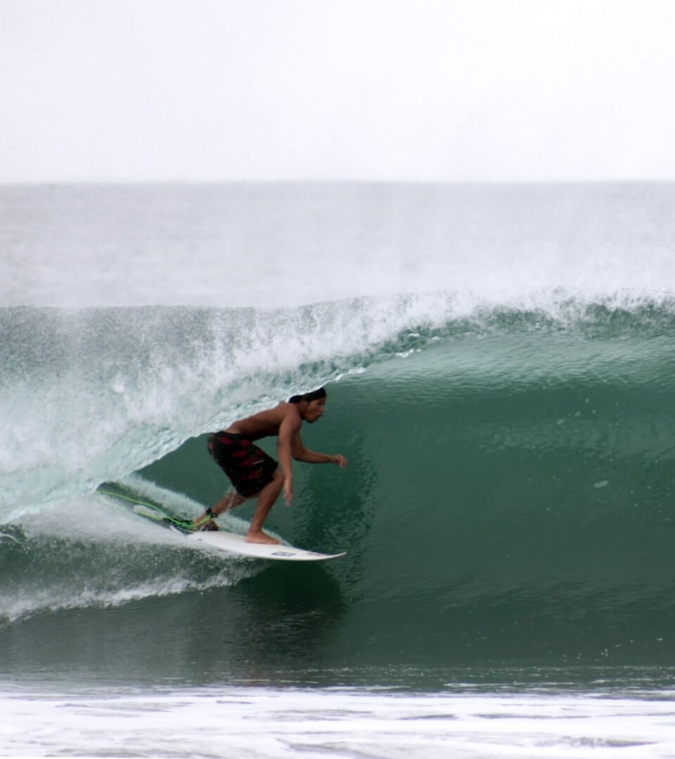 Surfer riding a barrel wave in Baja California Sur