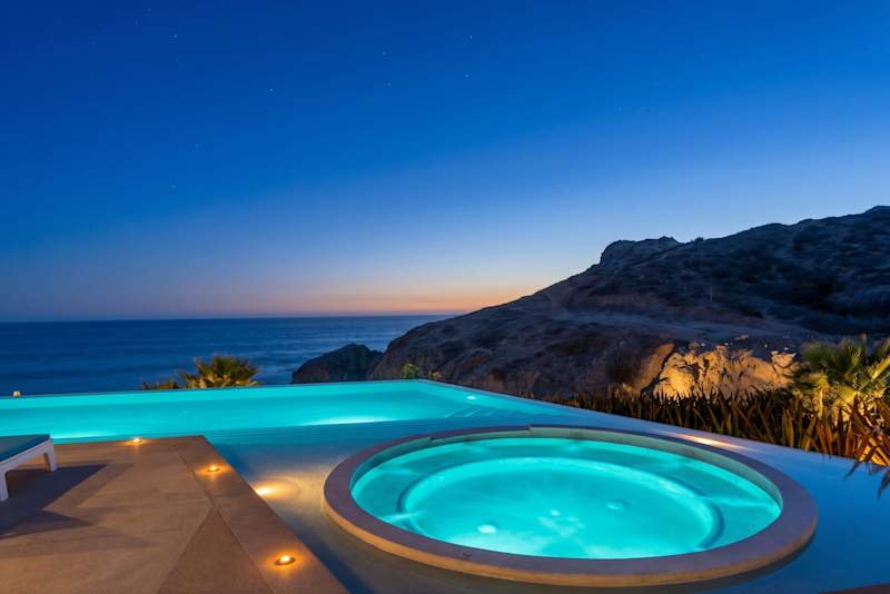 Infinity pool and jacuzzi at dusk at The Cove, Cerritos