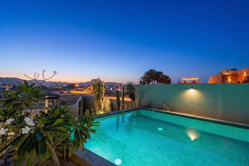 Pool lit up at blue hour at The Point, Cerritos